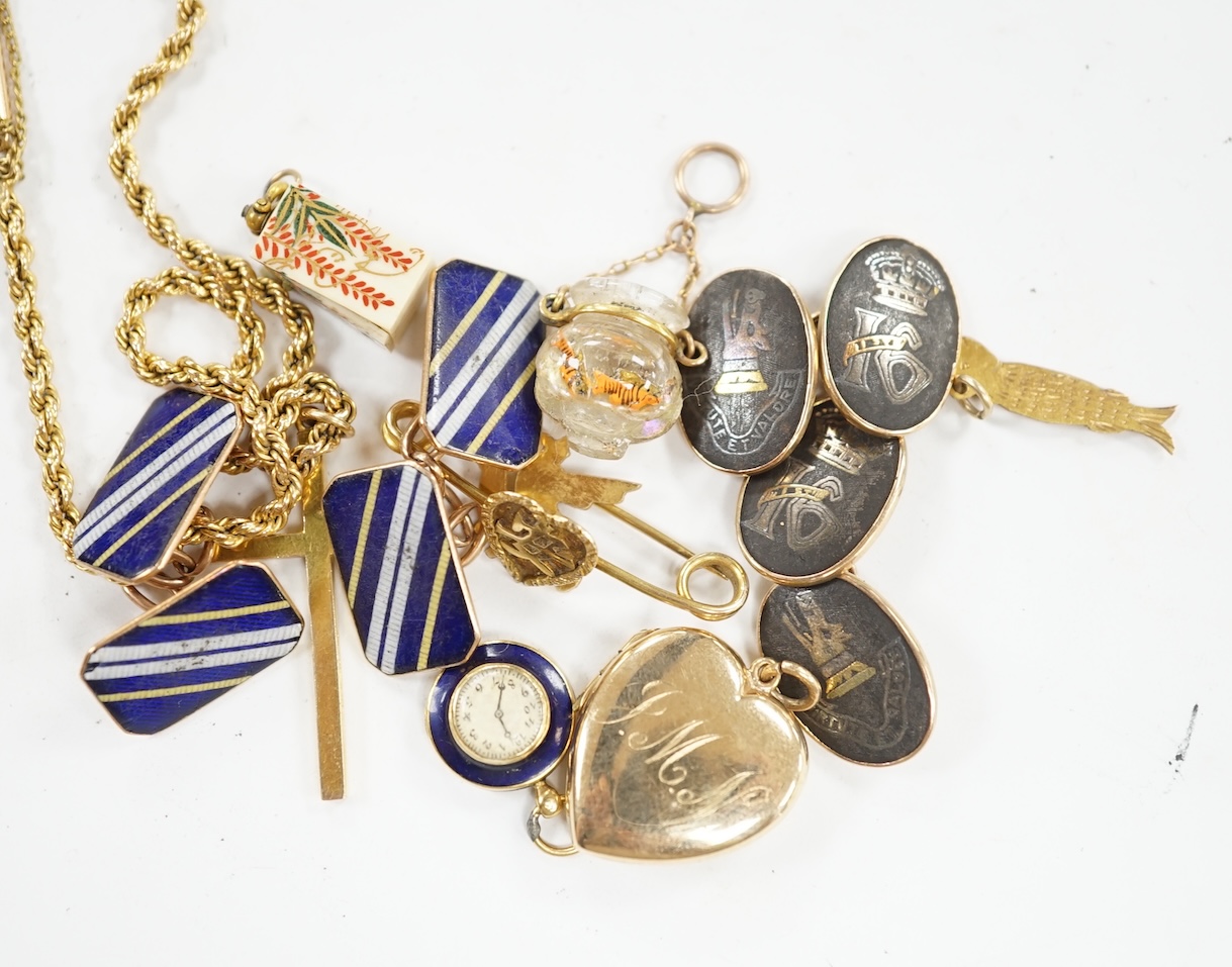 Sundry jewellery including a pair of 14k cufflinks, pair of 9ct cufflinks, a yellow metal rope twist chain with 9ct gold cross pendant, a 9ct gold heart shaped locket and six other items. Condition - poor to fair